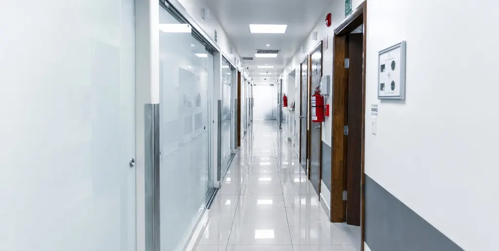 The long white main corridor inside the partner clinic in Tijuana.
